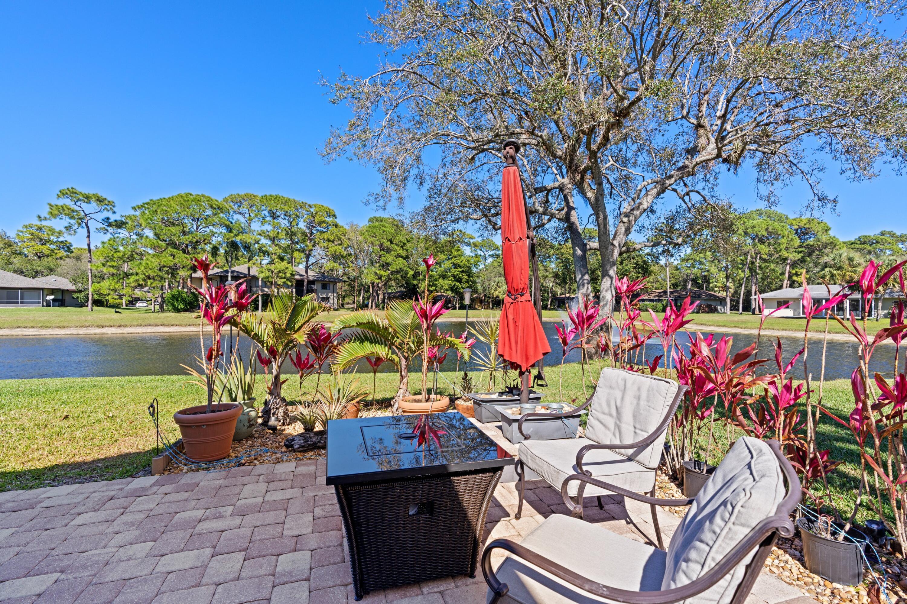 7676 Kings Ride Boynton Beach, FL 33436 - Photo 18 of 41 a view of an chairs and tables in the patio