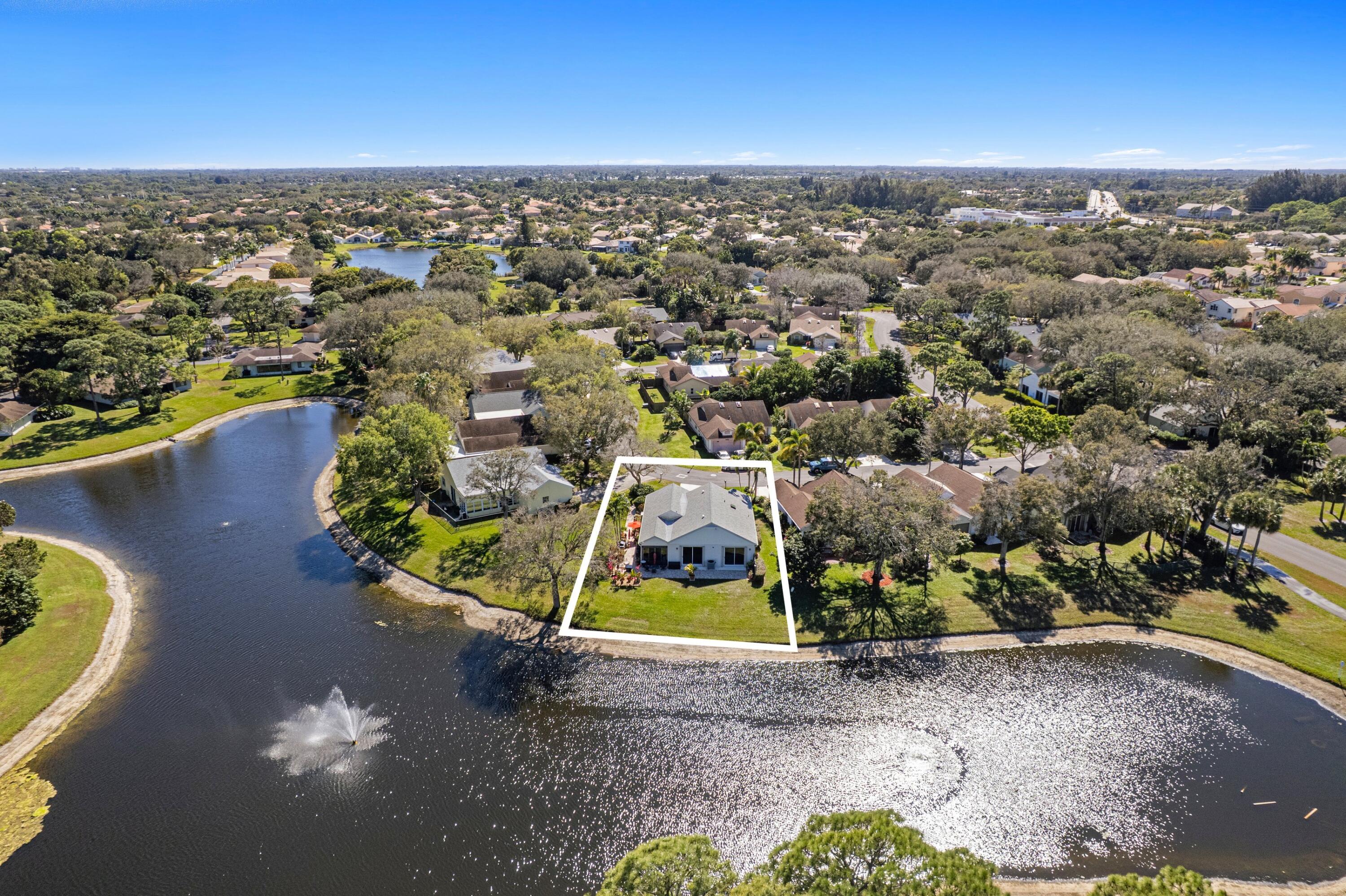 7676 Kings Ride Boynton Beach, FL 33436 - Photo 2 of 41 an aerial view of residential houses with outdoor space and swimming pool