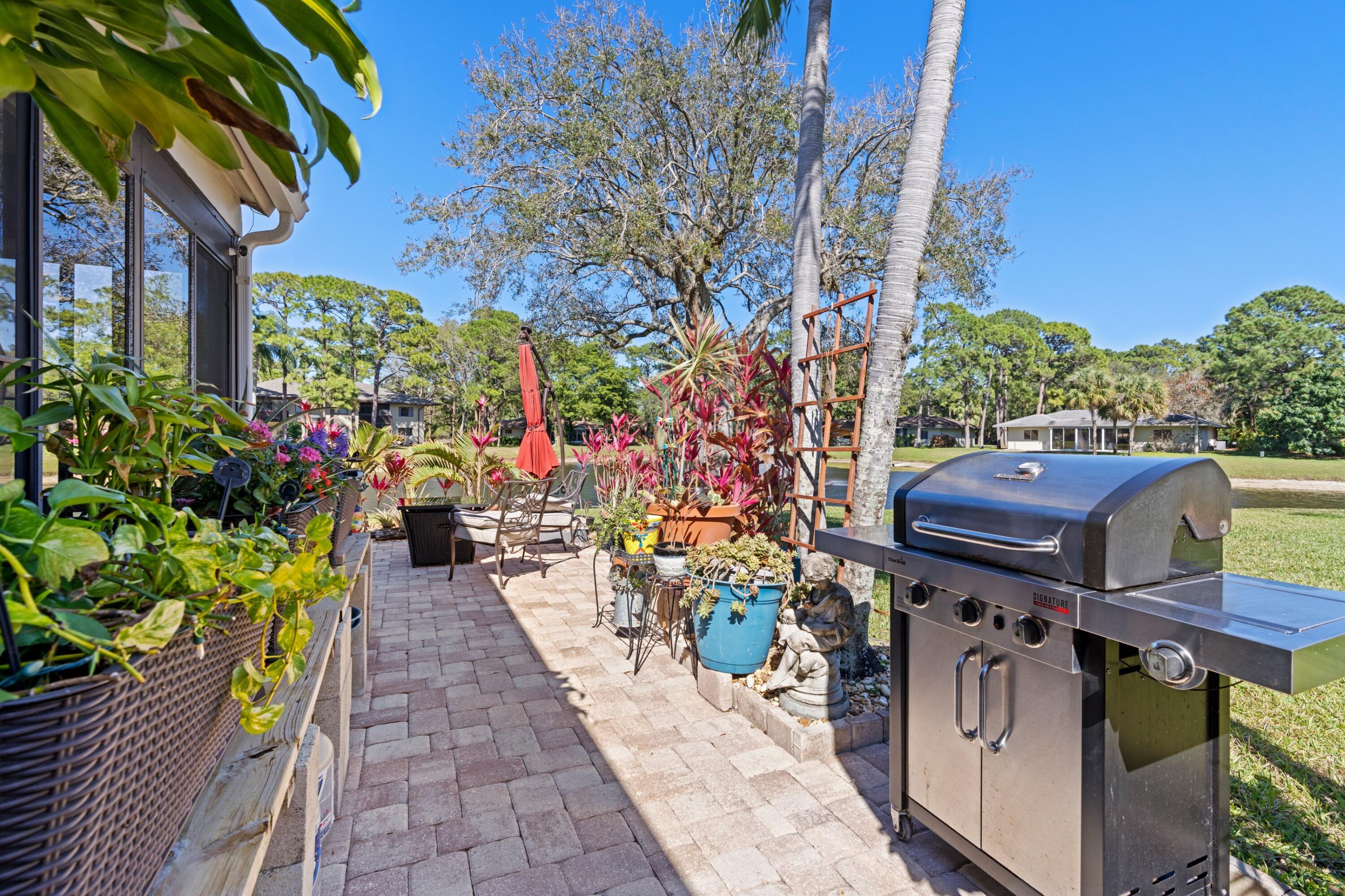 7676 Kings Ride Boynton Beach, FL 33436 - Photo 20 of 41 a view of a garden with sitting area