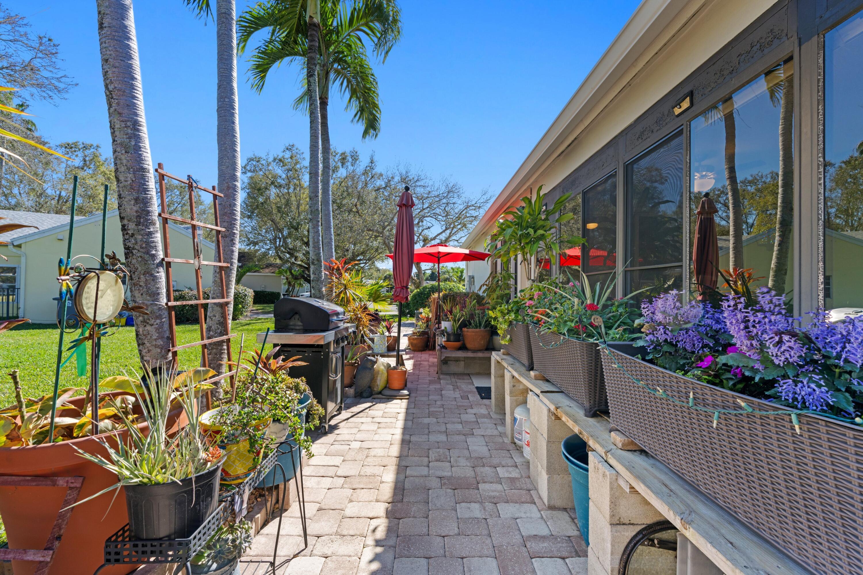 7676 Kings Ride Boynton Beach, FL 33436 - Photo 21 of 41 a view of a potted flower in the corridor