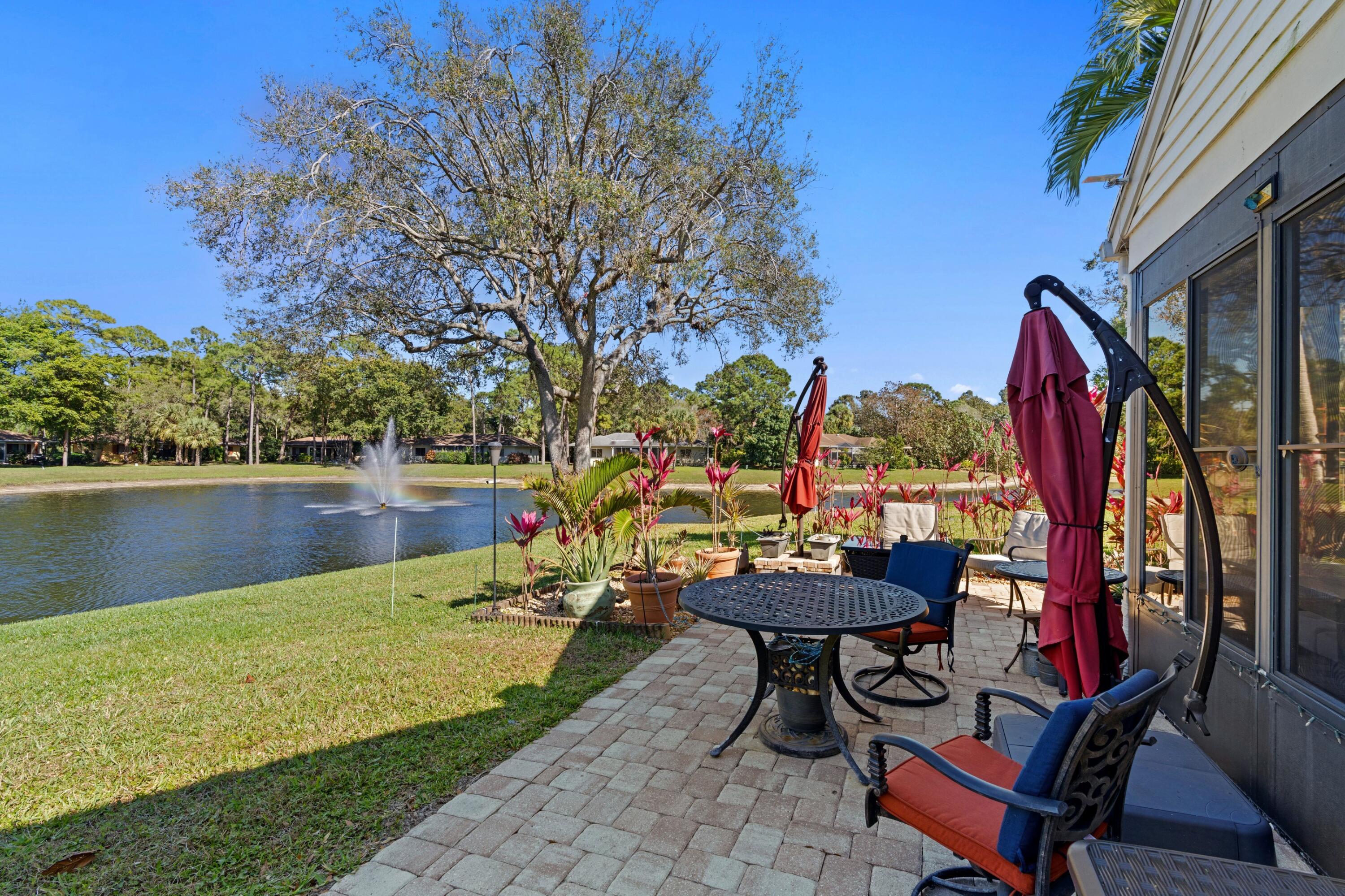 7676 Kings Ride Boynton Beach, FL 33436 - Photo 3 of 41 a view of swimming pool with a table and chairs