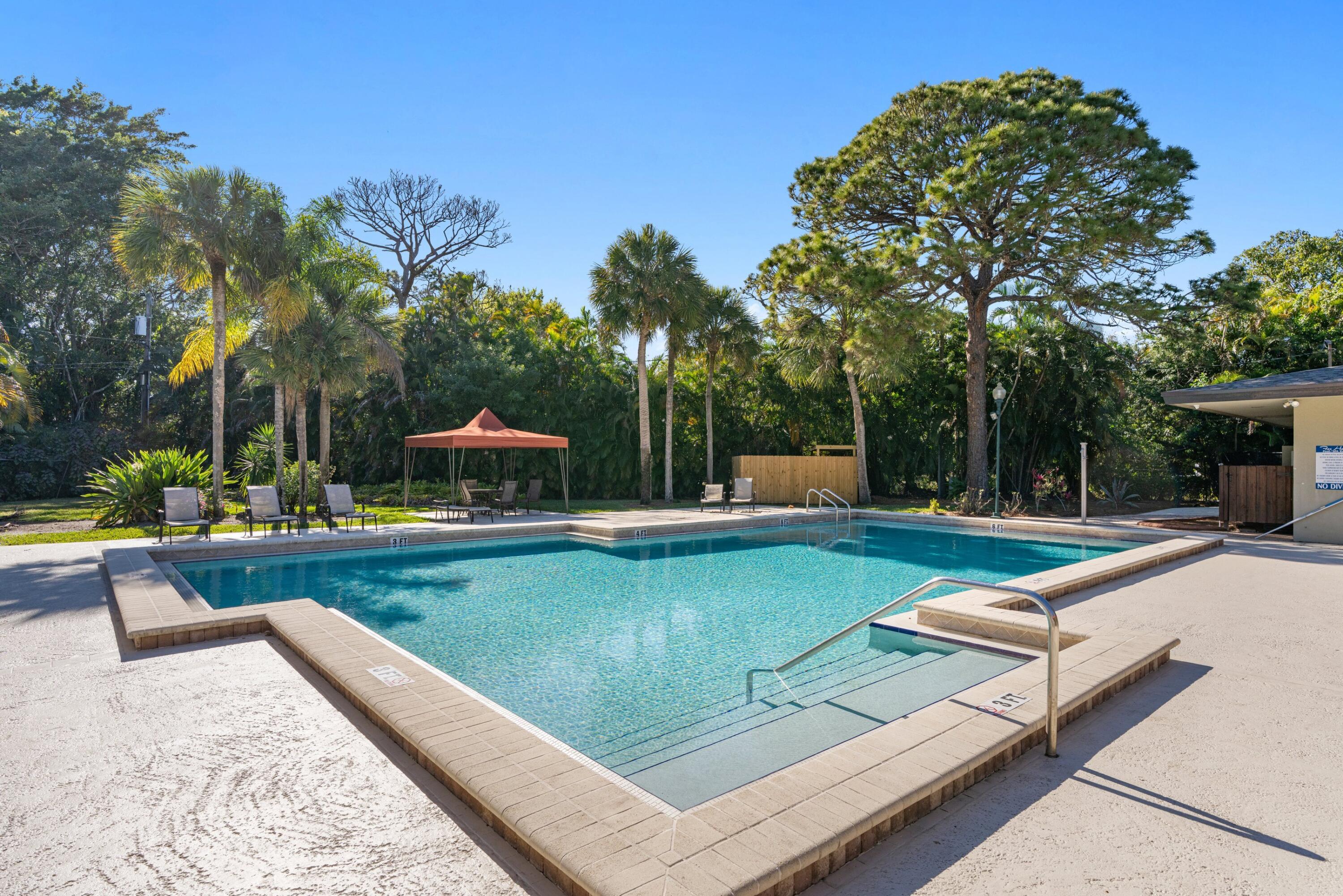 7676 Kings Ride Boynton Beach, FL 33436 - Photo 31 of 41 a view of swimming pool with lounge chair