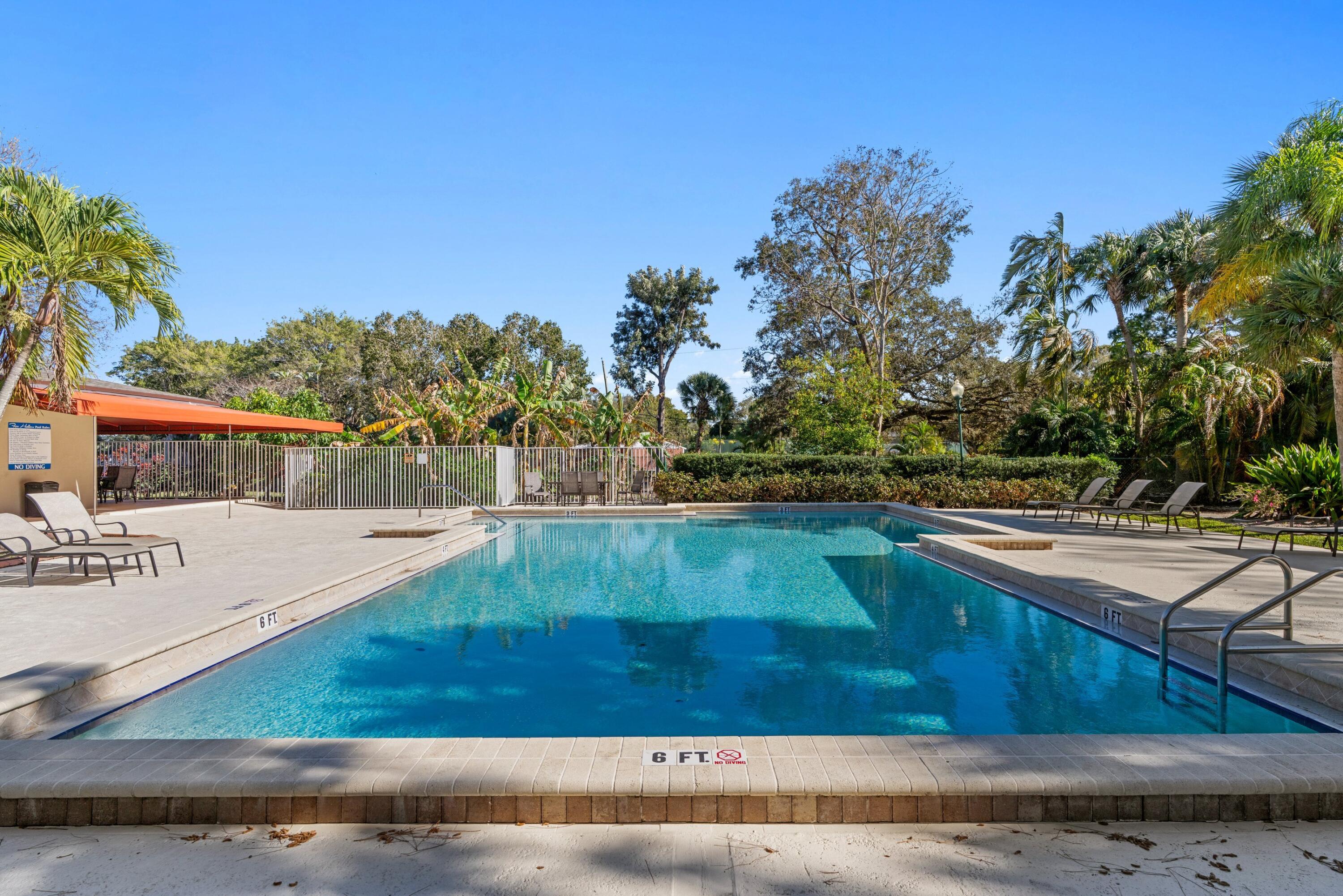 7676 Kings Ride Boynton Beach, FL 33436 - Photo 32 of 41 a view of a swimming pool with a yard