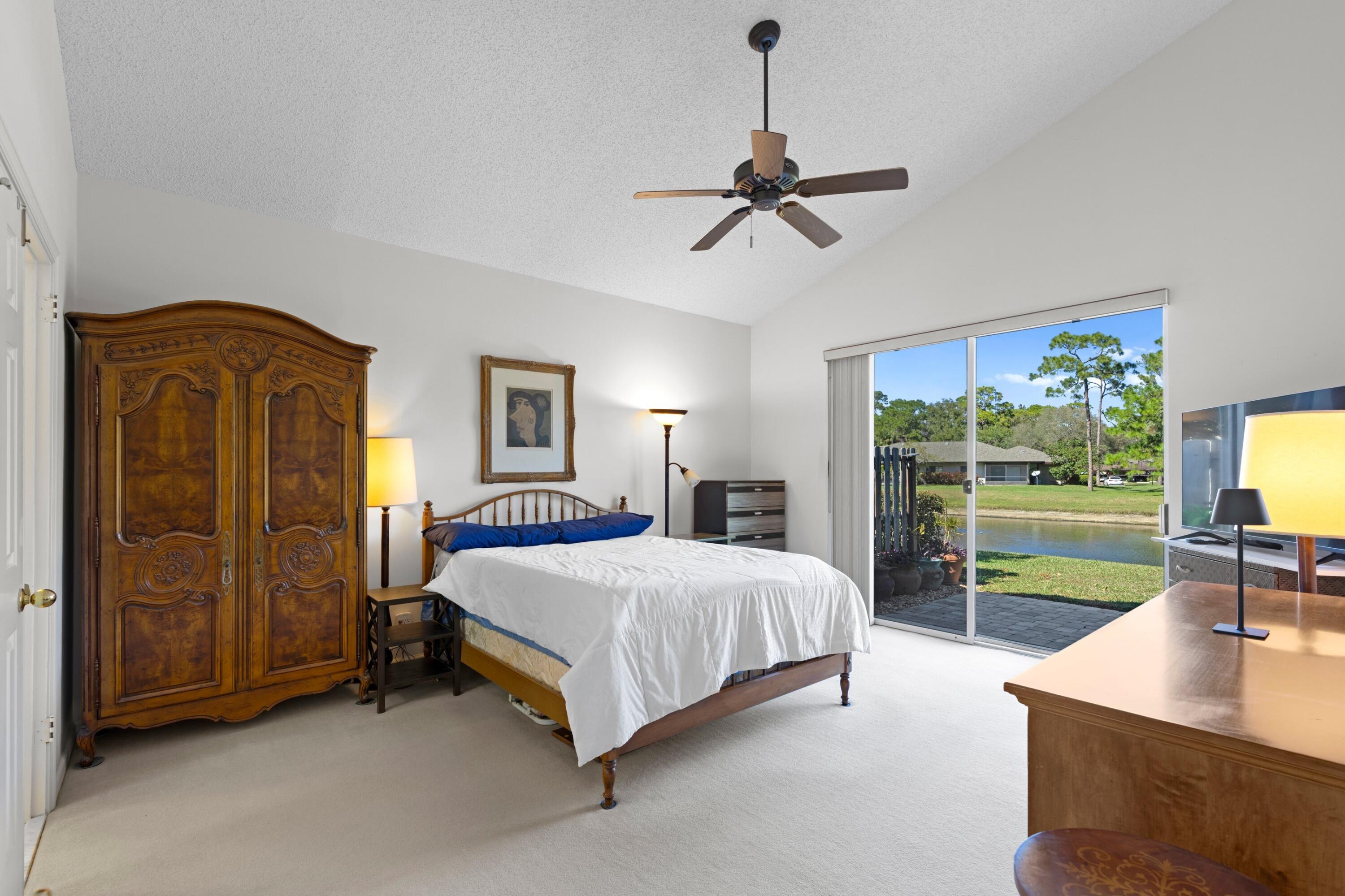 7676 Kings Ride Boynton Beach, FL 33436 - Photo 10 of 41 a bedroom with a bed and large window