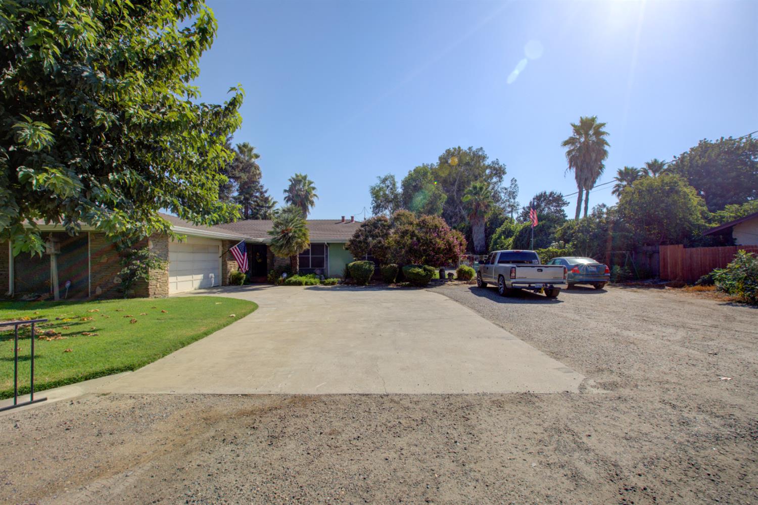5900 Washington Road Turlock, CA 95382 - Photo 13 of 56 a car parked in front of a house and a cars parked