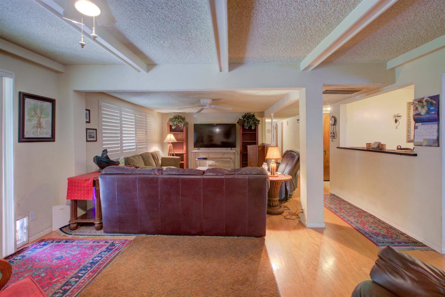 5900 Washington Road Turlock, CA 95382 - Photo 19 of 56 a living room with furniture and a wooden floor