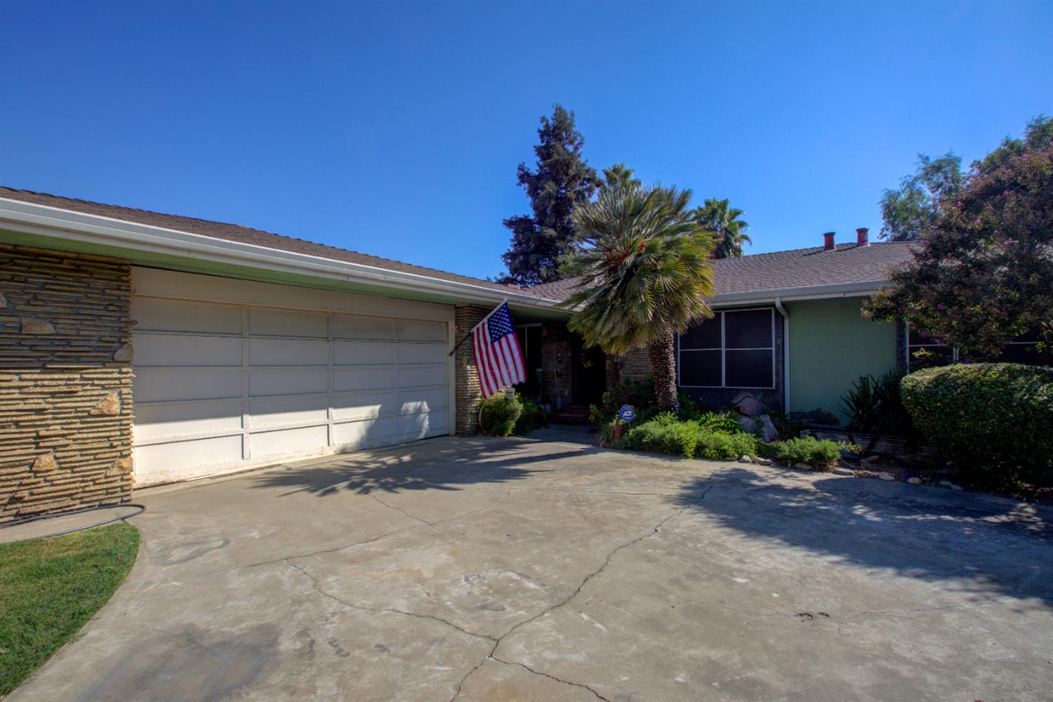 5900 Washington Road Turlock, CA 95382 - Photo 26 of 63 a view of a house with a yard and garage
