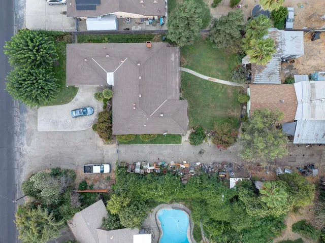 an aerial view of a house with a yard and garden