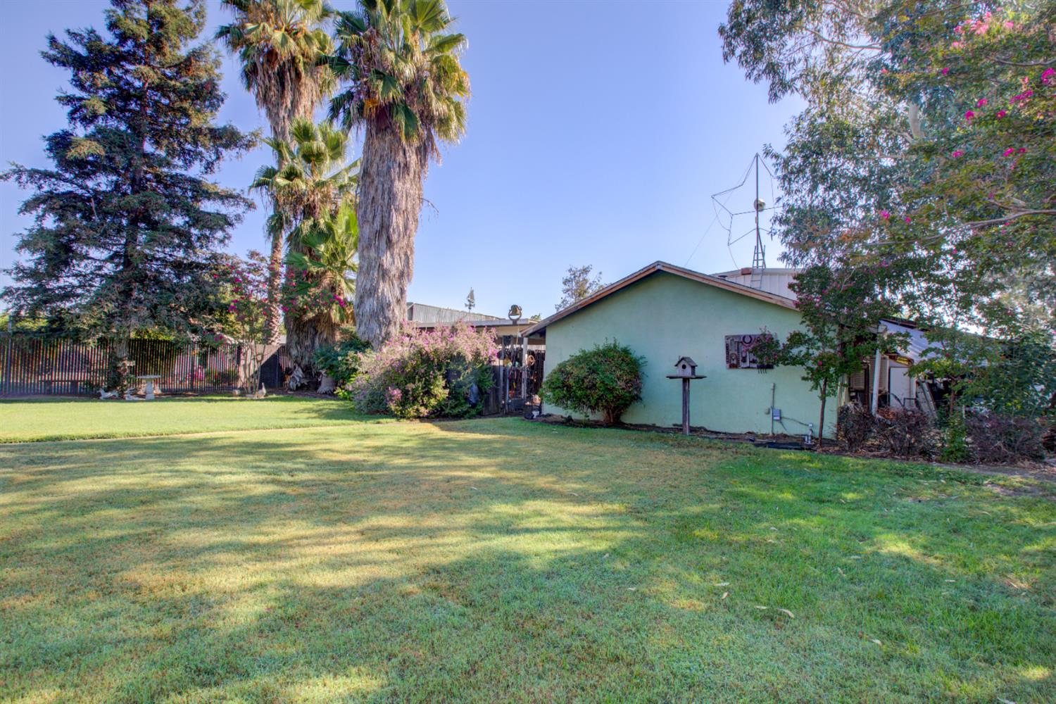 5900 Washington Road Turlock, CA 95382 - Photo 49 of 56 a front view of house with yard and trees