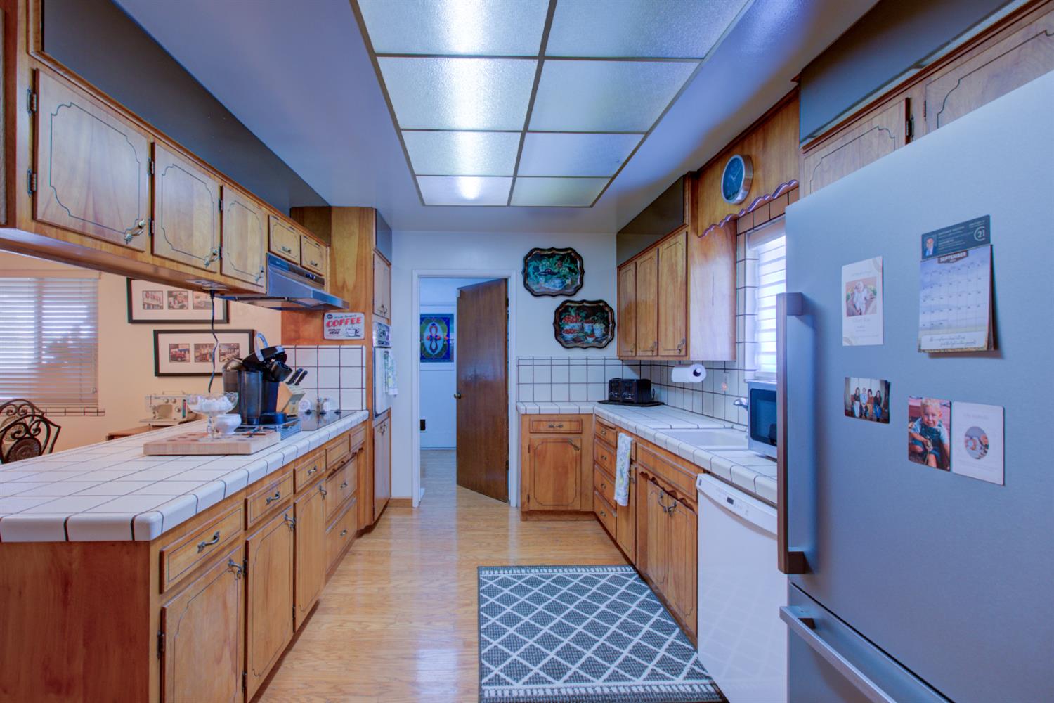 5900 Washington Road Turlock, CA 95382 - Photo 50 of 56 a kitchen with stainless steel appliances granite countertop a sink and cabinets