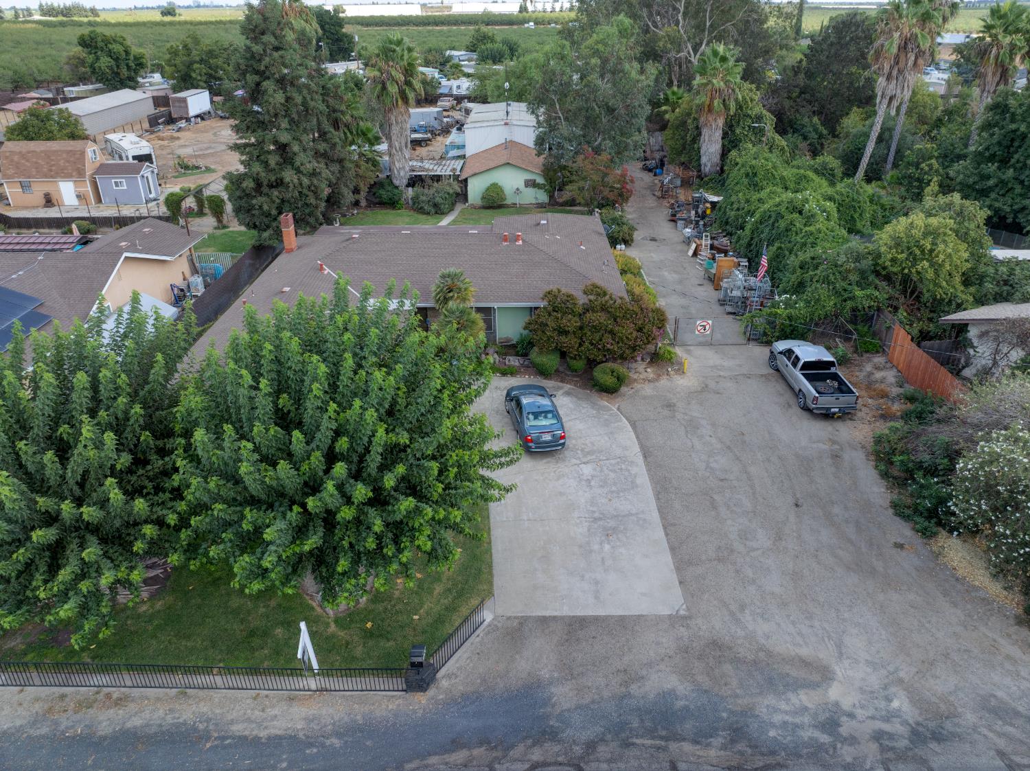 5900 Washington Road Turlock, CA 95382 - Photo 5 of 56 an aerial view of a house with a yard and garden