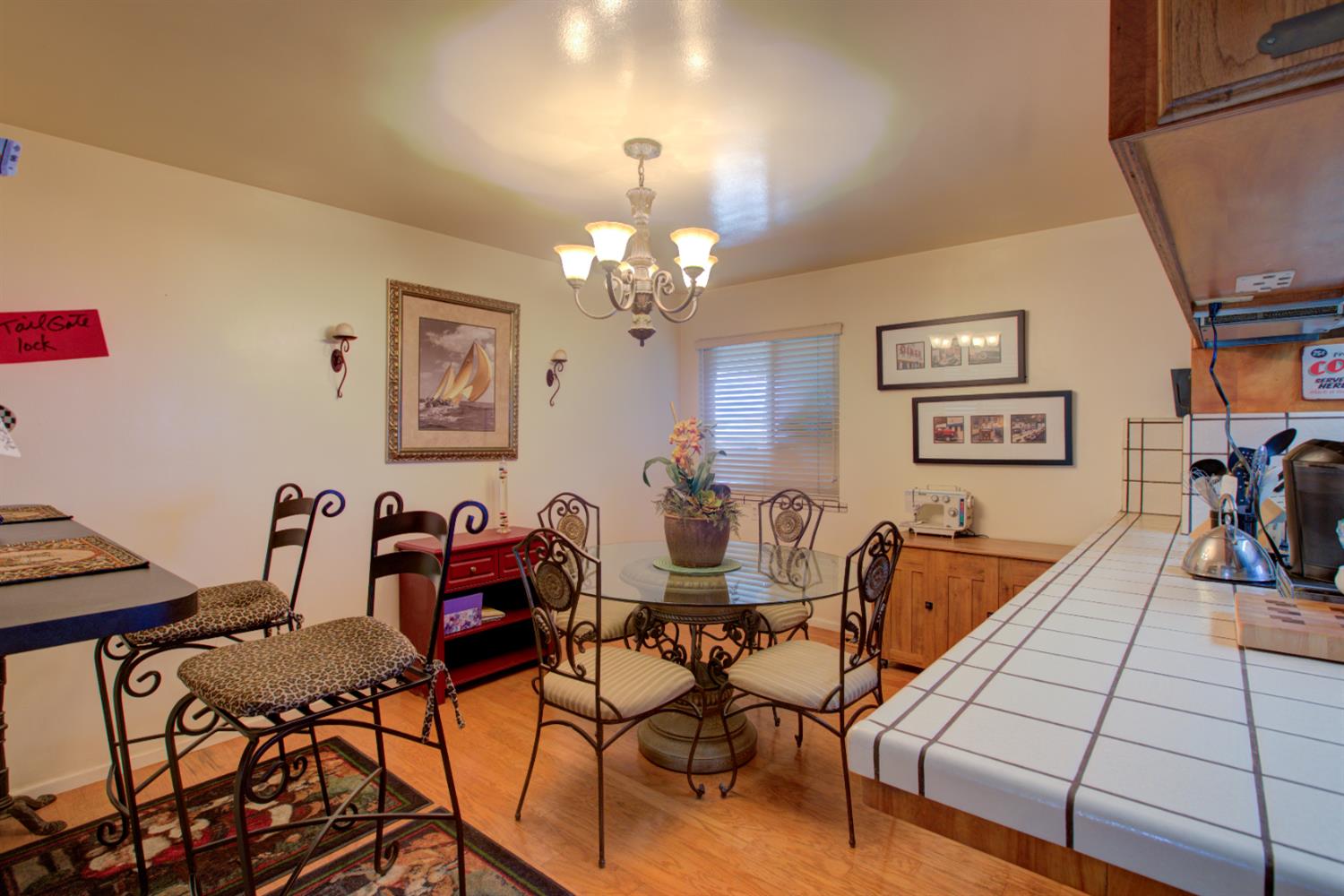 5900 Washington Road Turlock, CA 95382 - Photo 52 of 63 a view of a dining room with furniture and chandelier