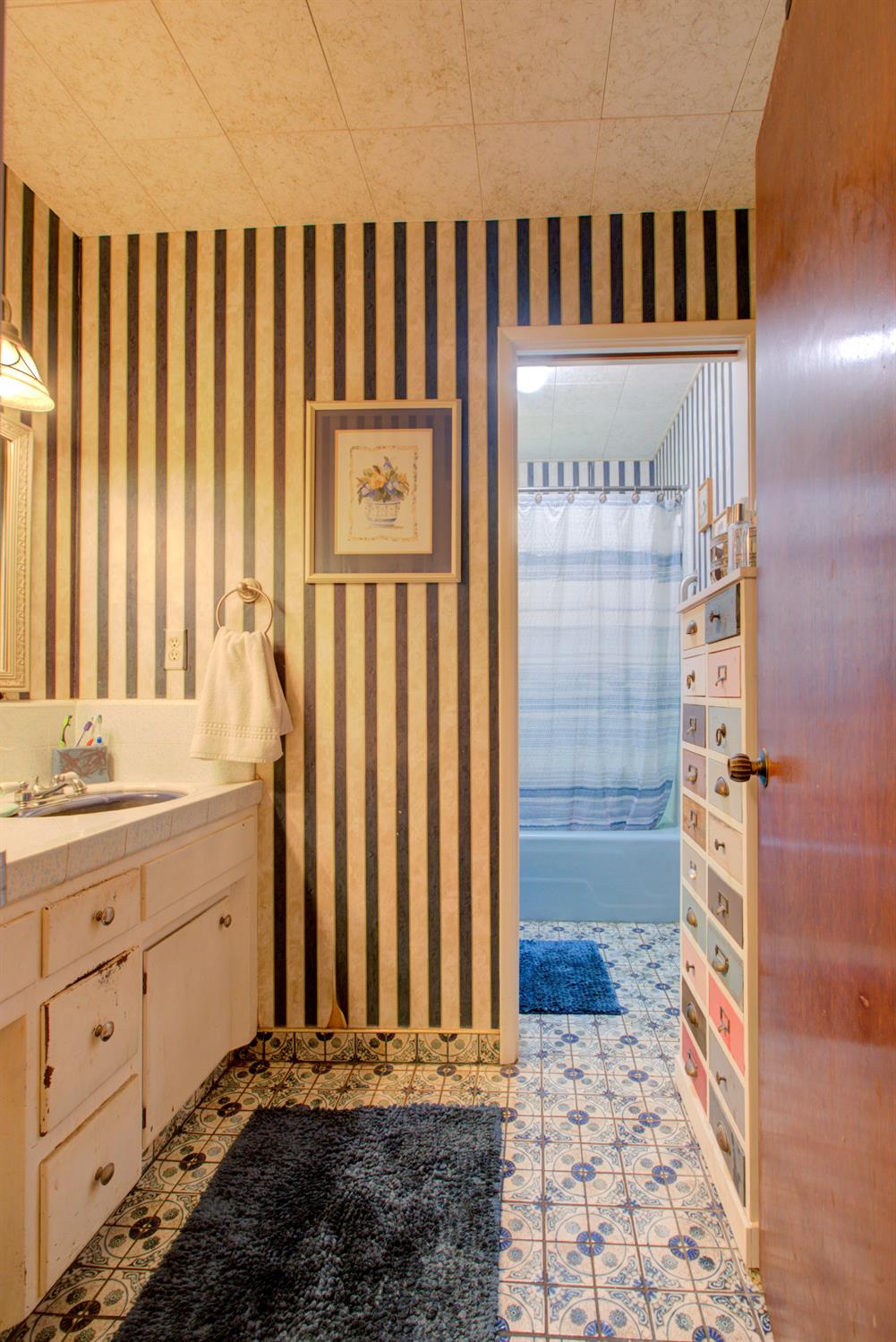 5900 Washington Road Turlock, CA 95382 - Photo 55 of 56 a bathroom with a sink a toilet and shower