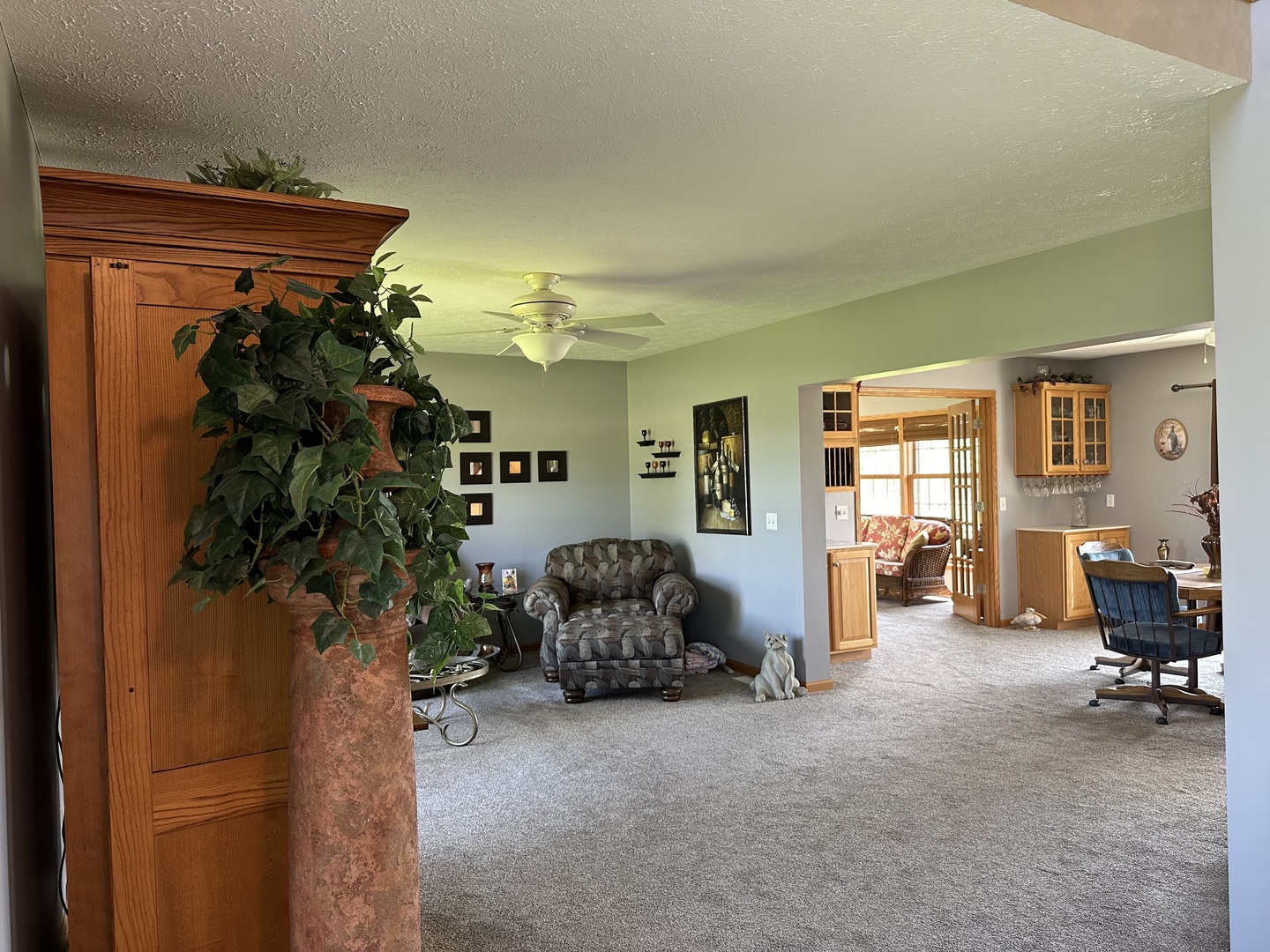 14919 Henry Road Morrison, IL 61270 - Photo 10 of 36 a hallway with a couch and a potted plant