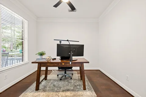 a workspace with furniture and a window