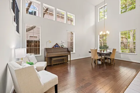 a living room with furniture a window and a table