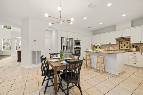 a view of a dining room with furniture