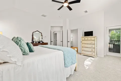 a bedroom with a bed and dresser