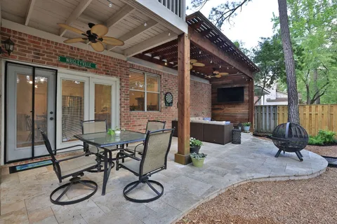 a outdoor living space with patio furniture and a grill