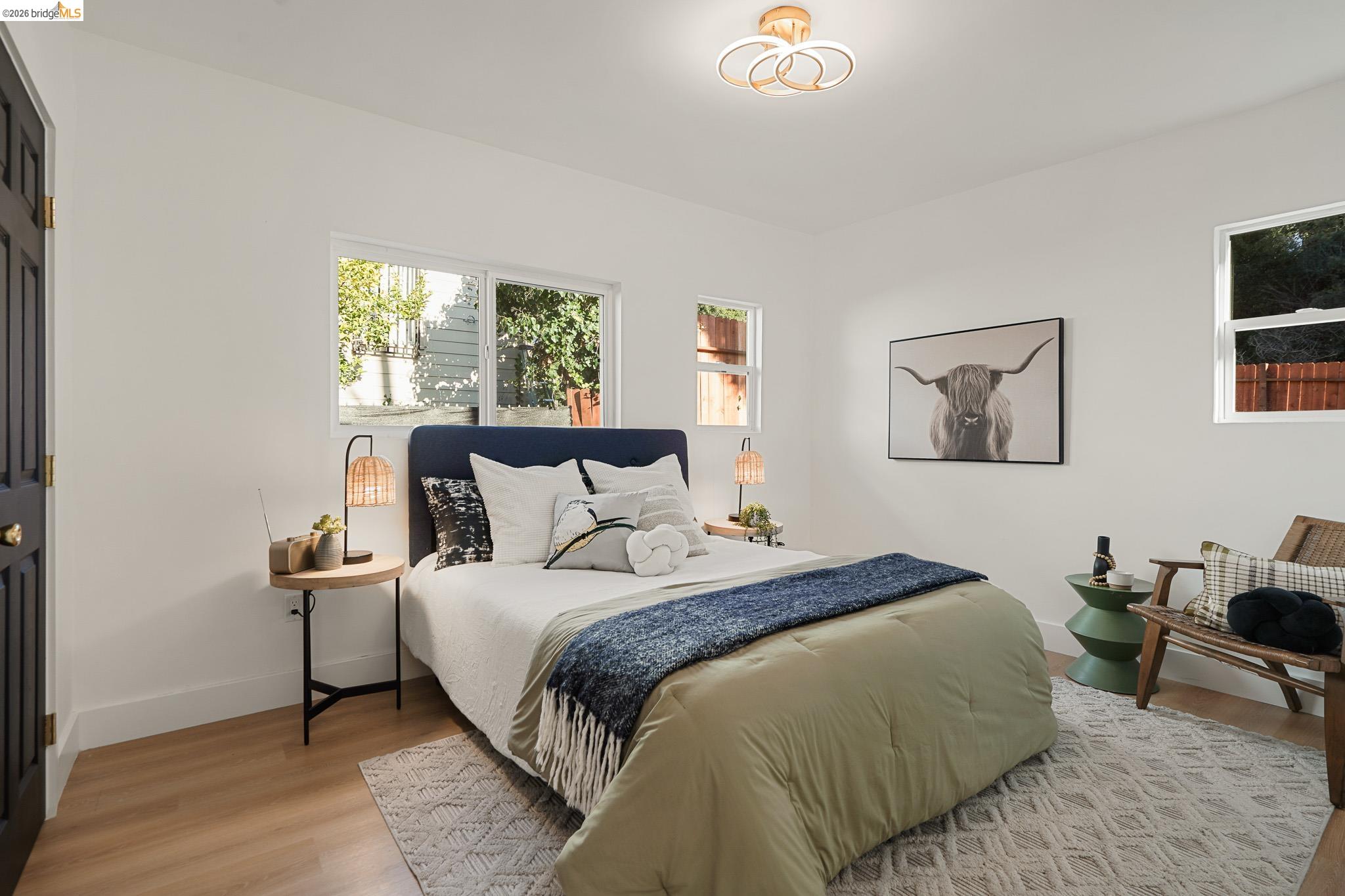 2151 Santa Rita Street Oakland, CA 94601 - Photo 23 of 46 Bedroom with light wood-style floors and baseboards