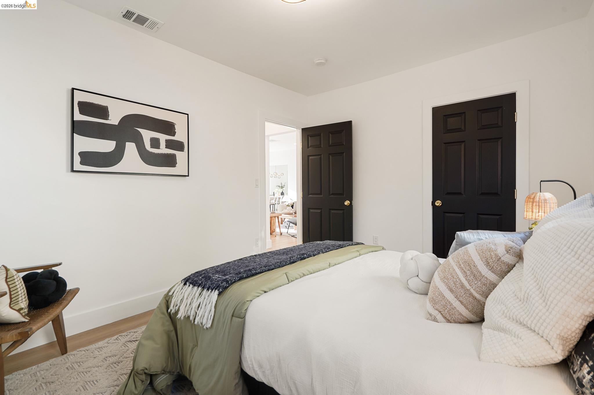 2151 Santa Rita Street Oakland, CA 94601 - Photo 25 of 46 Bedroom with wood finished floors and baseboards