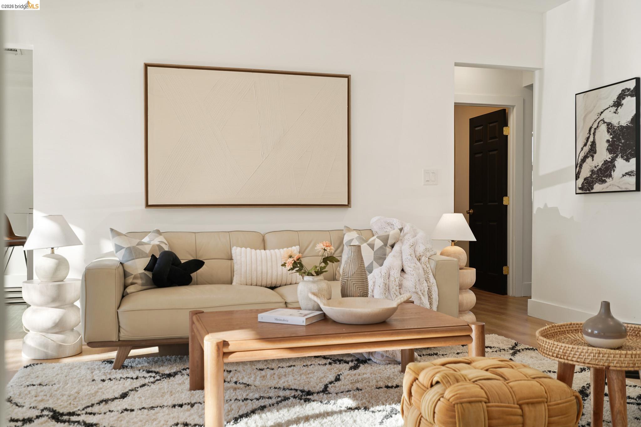 2151 Santa Rita Street Oakland, CA 94601 - Photo 5 of 46 Living area featuring wood finished floors and baseboards