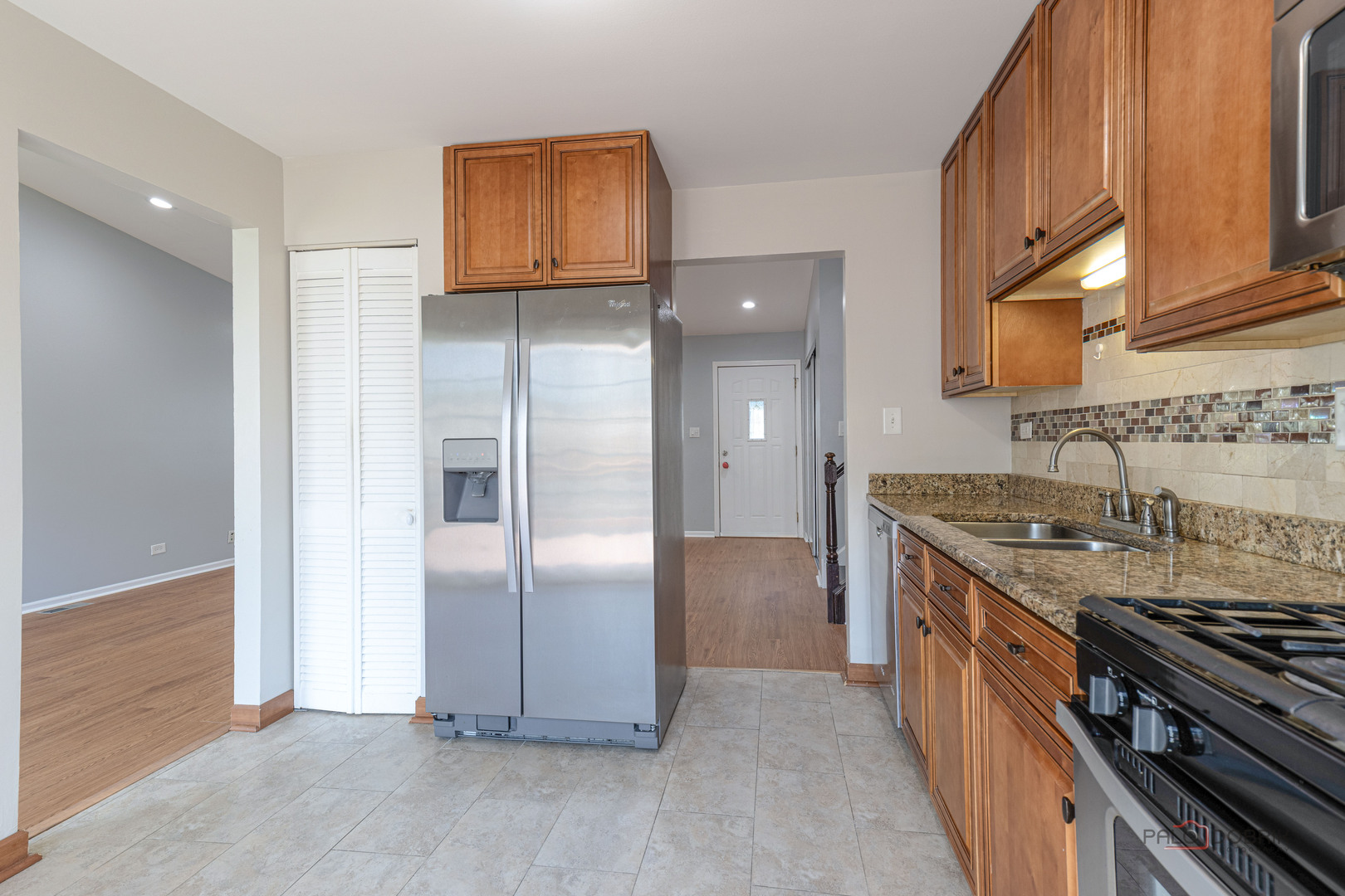 1680 Bicek Drive Hoffman Estates, IL 60192 - Photo 17 of 33 a kitchen with stainless steel appliances granite countertop a stove and a refrigerator