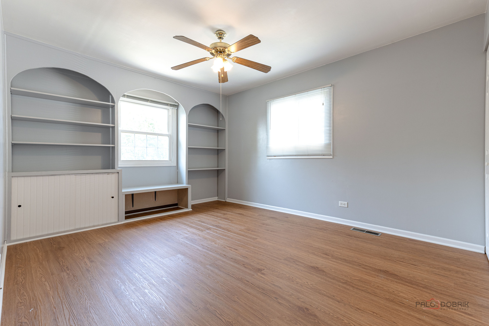 1680 Bicek Drive Hoffman Estates, IL 60192 - Photo 19 of 33 an empty room with wooden floor and windows