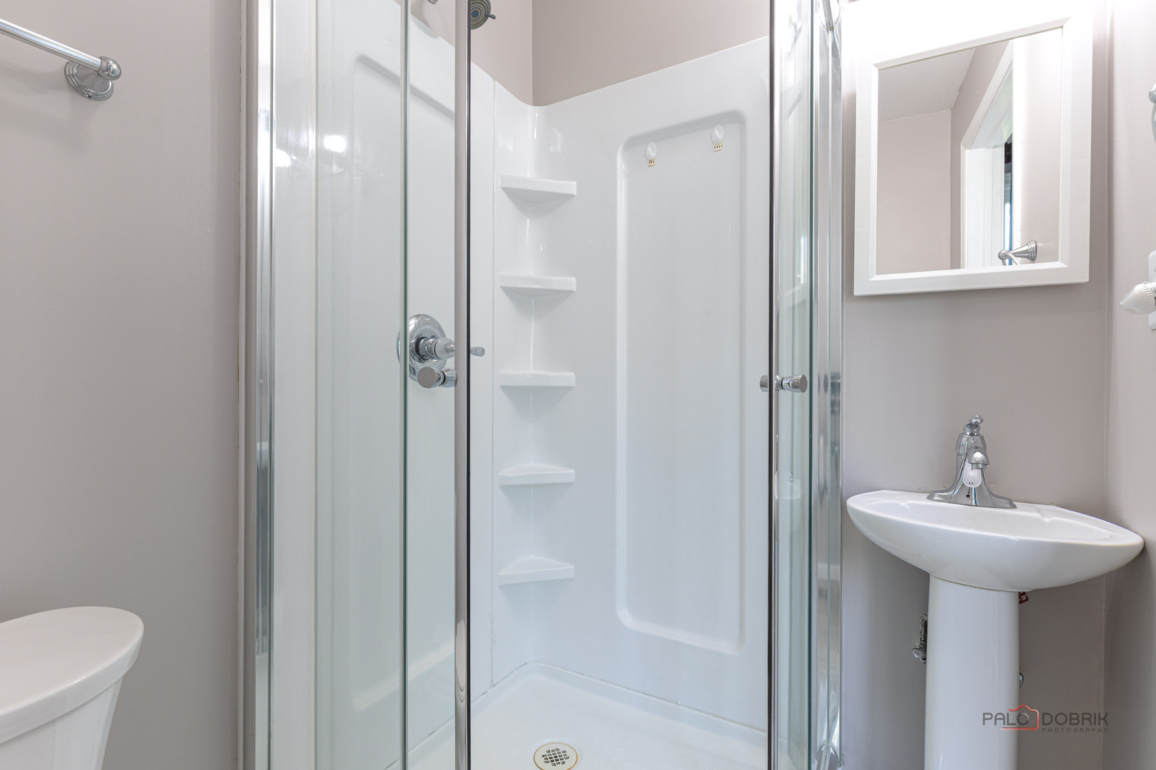 1680 Bicek Drive Hoffman Estates, IL 60192 - Photo 29 of 33 a bathroom with a sink a toilet and shower