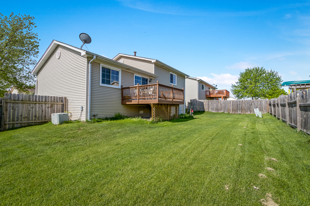 1680 Bicek Drive Hoffman Estates, IL 60192 - Photo 33 of 33 a front view of a house with garden