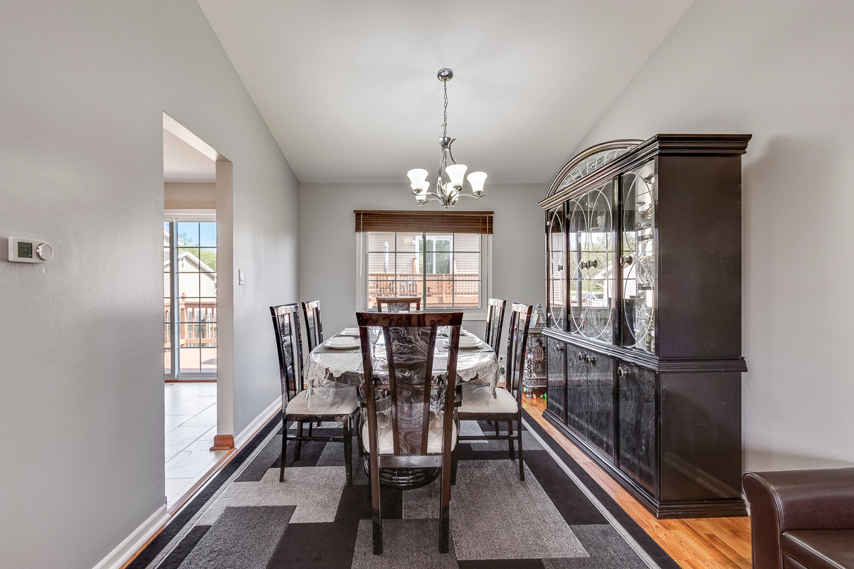 1680 Bicek Drive Hoffman Estates, IL 60192 - Photo 9 of 33 a view of a dining room with furniture window and wooden floor