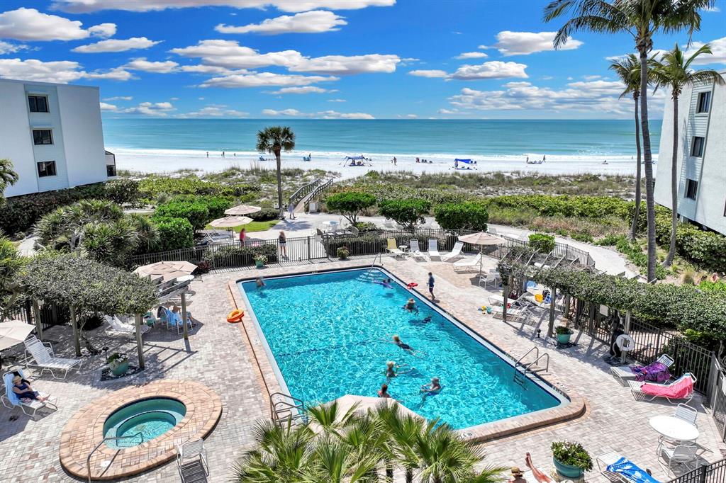 a view of a swimming pool with a patio
