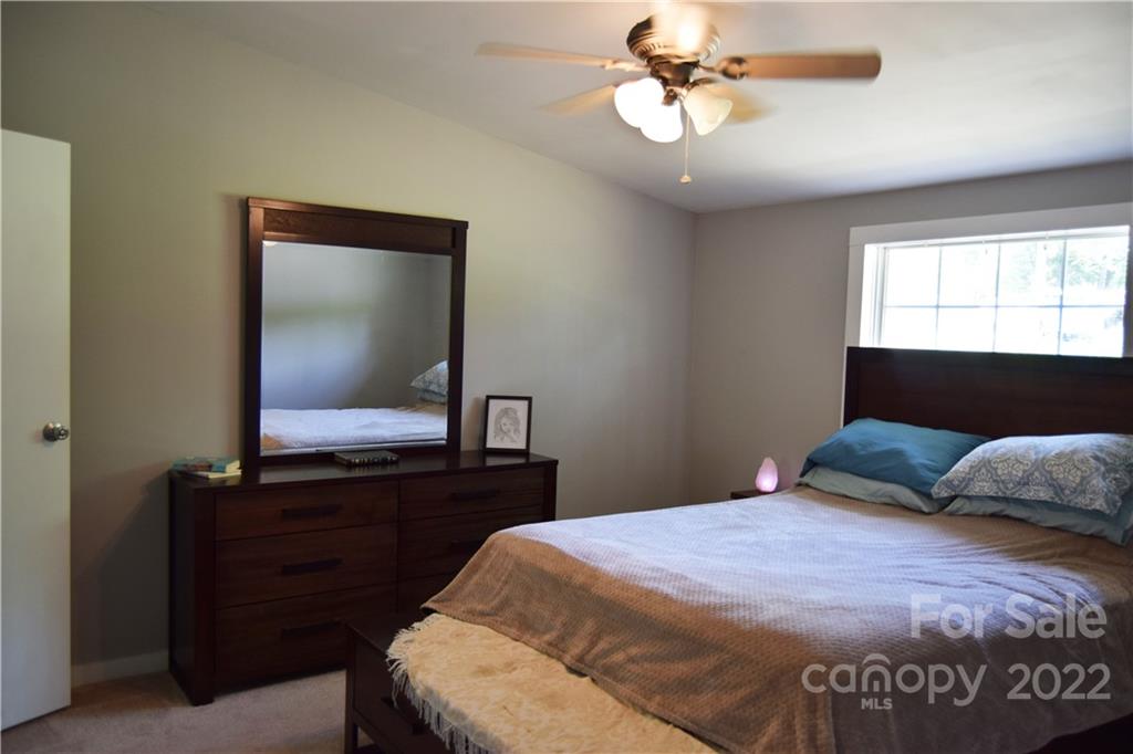 34 Souther Road Fletcher, NC 28732 - Photo 5 of 16 a bedroom with a bed and a dresser