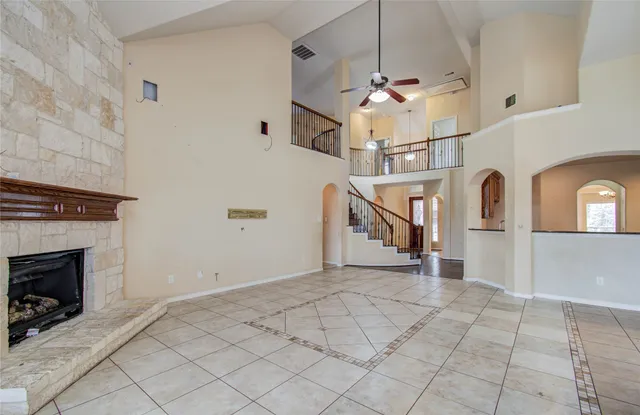 a bathroom with a granite countertop sink a mirror and a shower