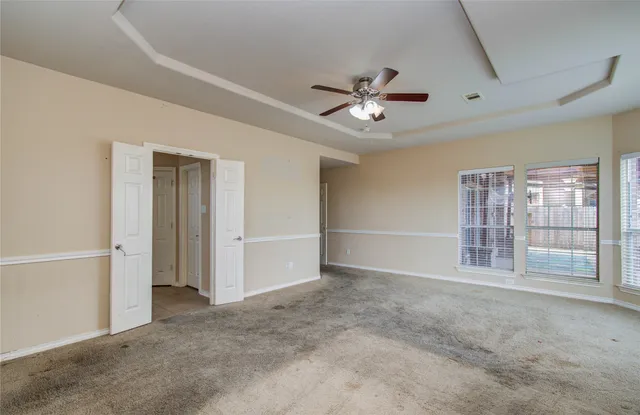 an empty room with a empty space and a window