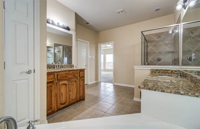 a view of an ocean with a floor to ceiling window and wooden floor