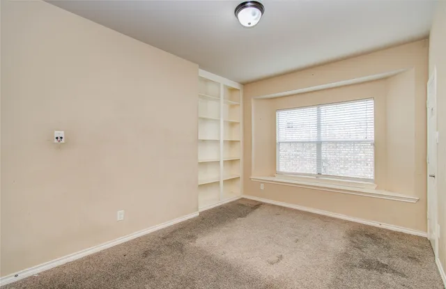 a front view of a house with a large window