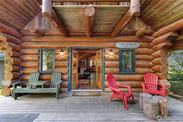 a building outdoor space with patio furniture and wooden floor