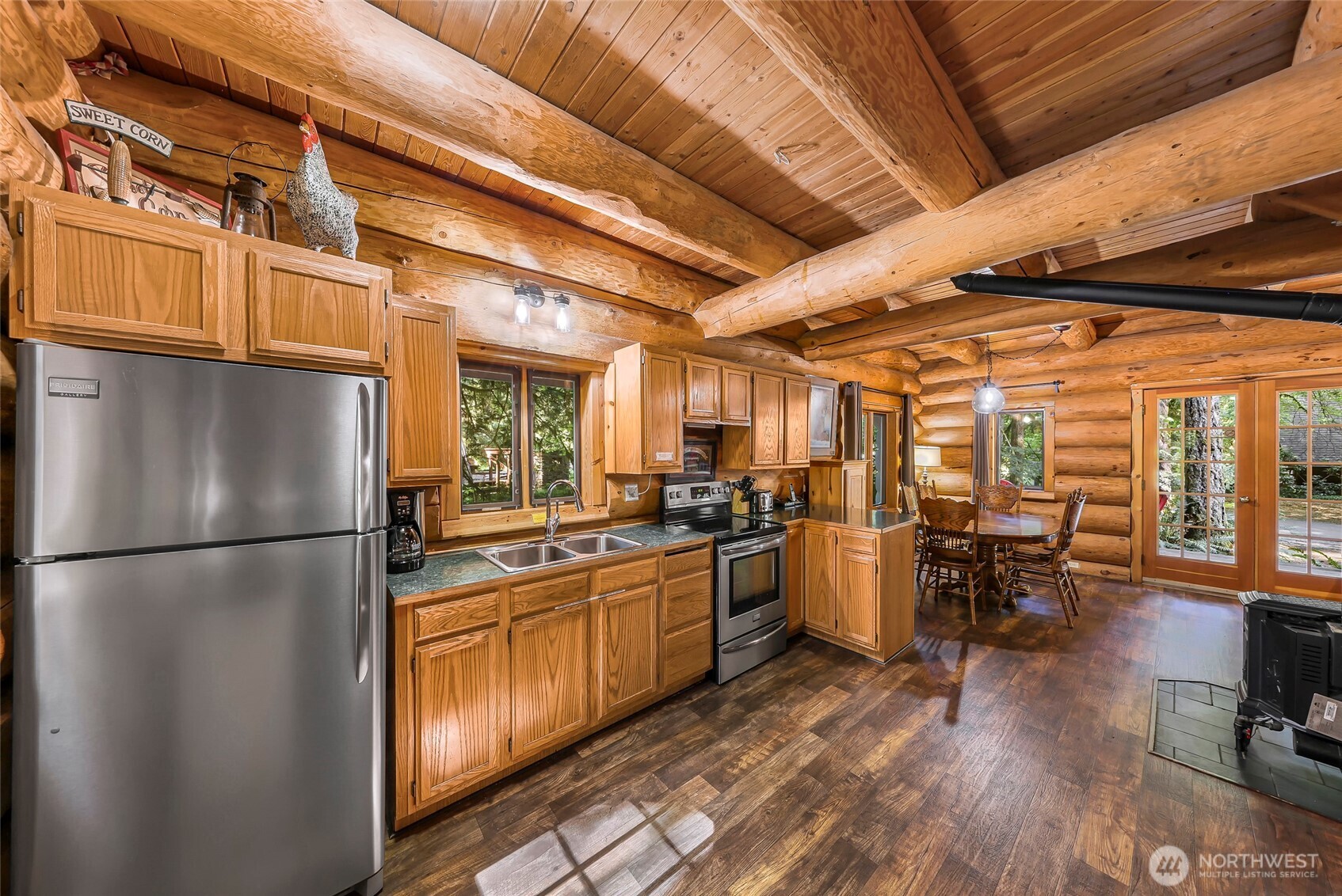 7010 Rainier Way Deming, WA 98244 - Photo 13 of 35 a kitchen with lots of counter top space and stainless steel appliances