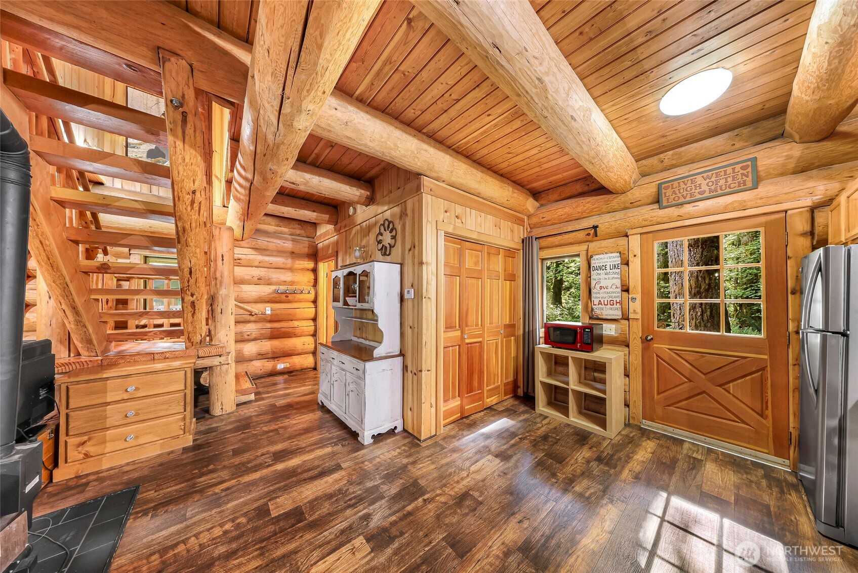 7010 Rainier Way Deming, WA 98244 - Photo 15 of 35 a view of empty room with wooden floor and windows