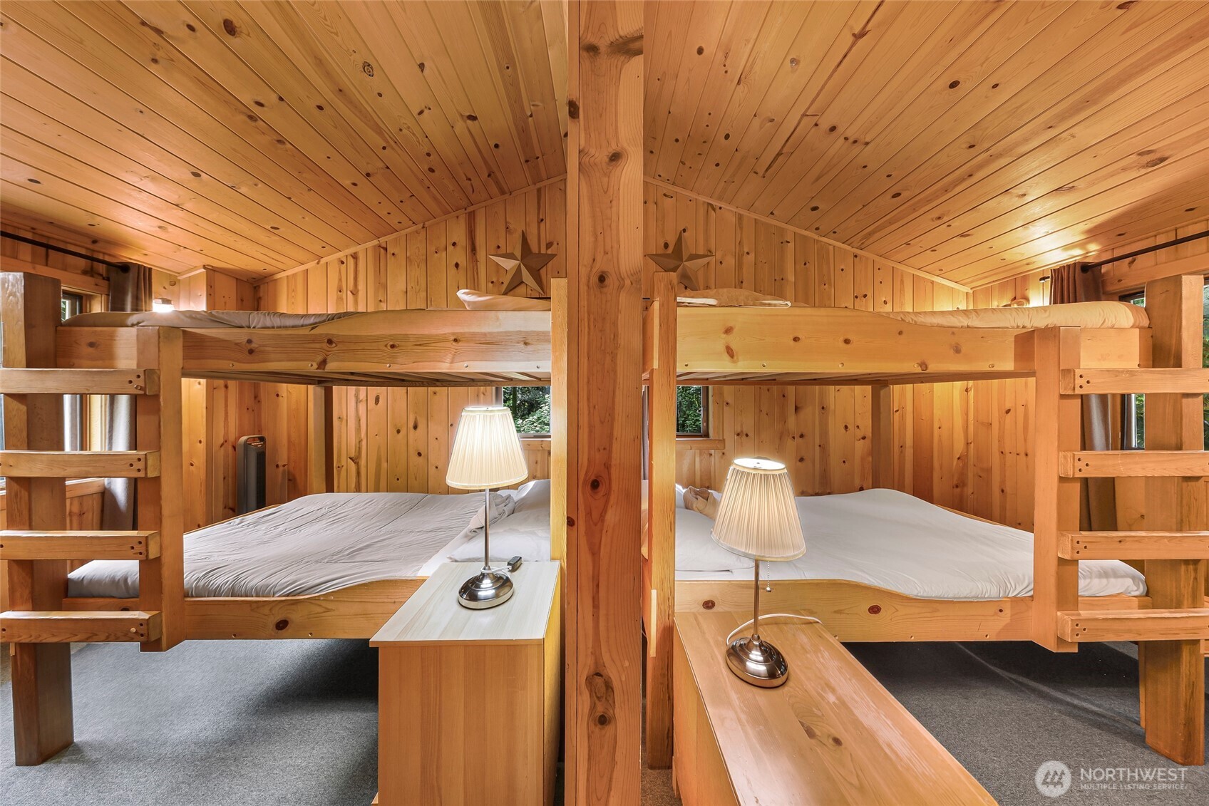 7010 Rainier Way Deming, WA 98244 - Photo 19 of 35 a bedroom with a bed and large cabinets