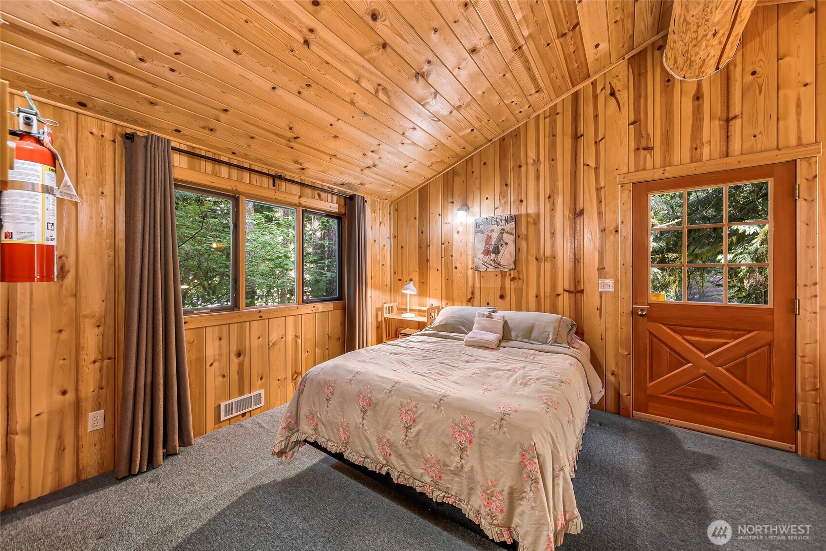 7010 Rainier Way Deming, WA 98244 - Photo 24 of 35 a bedroom with a bed and glass door