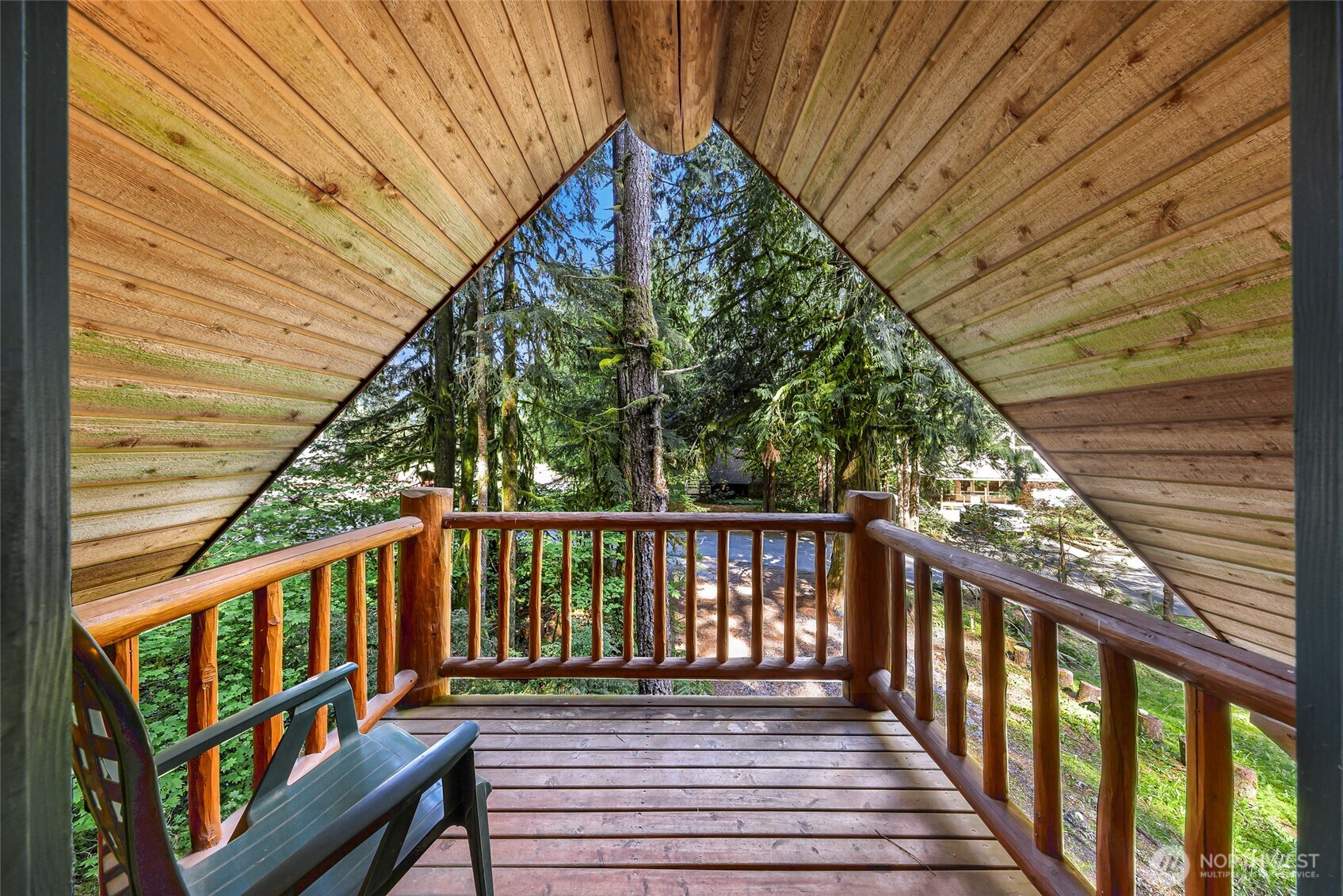 7010 Rainier Way Deming, WA 98244 - Photo 26 of 35 a balcony with wooden floor and outdoor seating