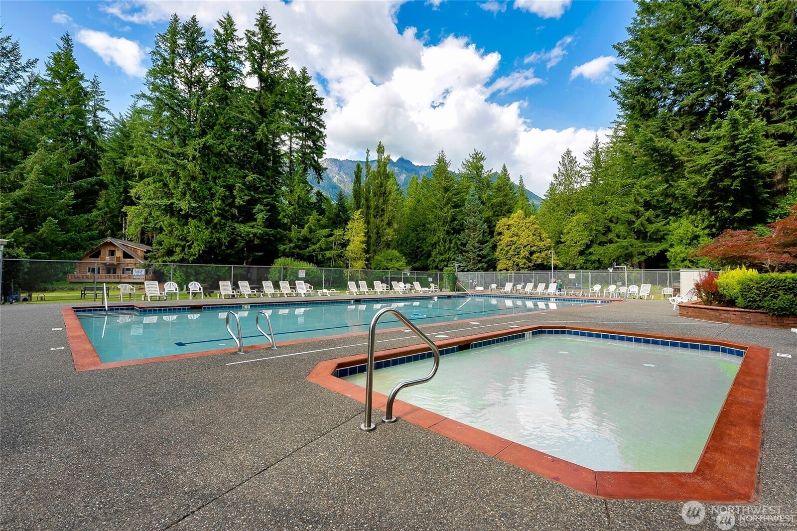 7010 Rainier Way Deming, WA 98244 - Photo 30 of 35 a view of a swimming pool with a lawn chairs