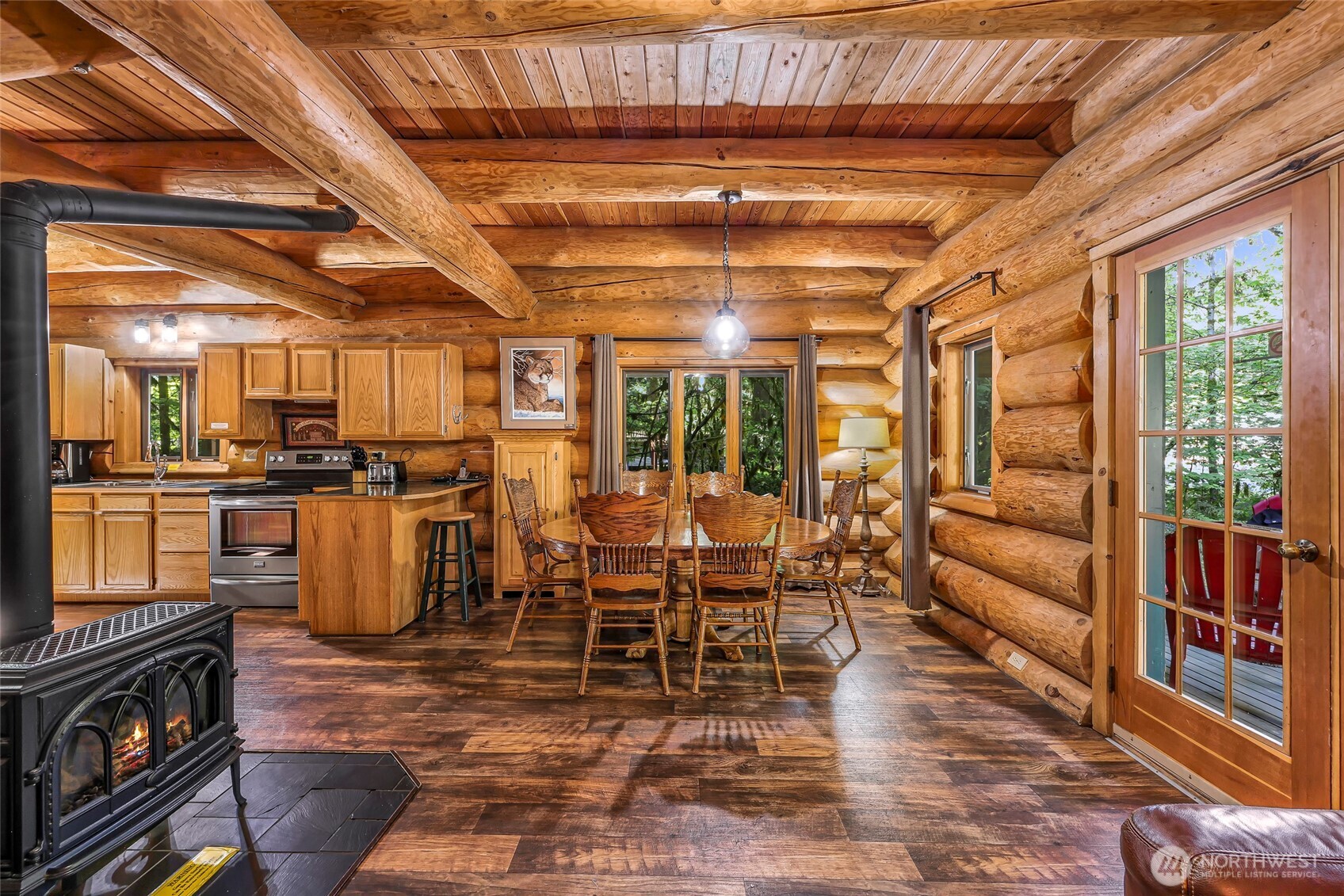 7010 Rainier Way Deming, WA 98244 - Photo 9 of 35 a room with lots of wooden furniture and stainless steel appliances