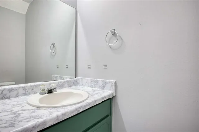 a view of a backyard with large trees