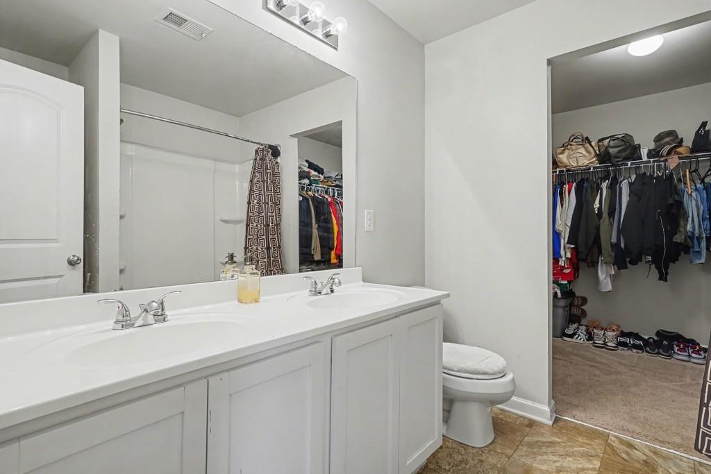 345 Arthurs Lane Covington, GA 30016 - Photo 20 of 33 a bathroom with a sink toilet and shower