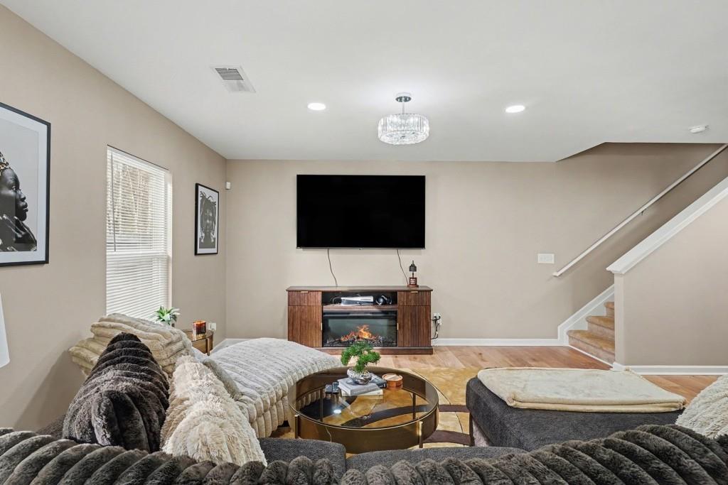 345 Arthurs Lane Covington, GA 30016 - Photo 2 of 33 a living room with furniture and a flat screen tv