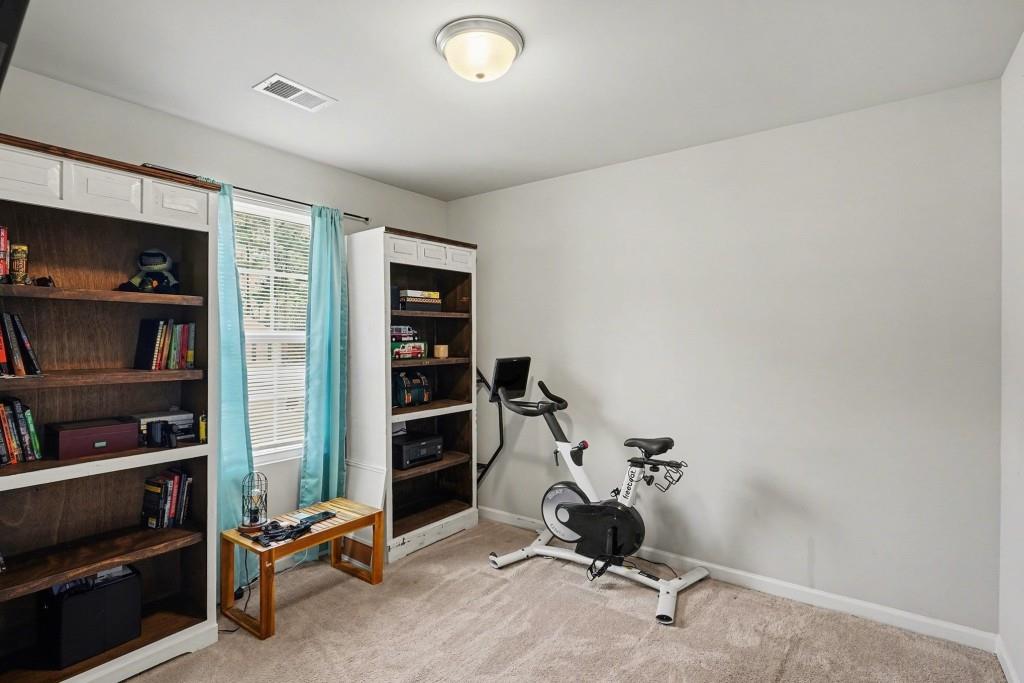 345 Arthurs Lane Covington, GA 30016 - Photo 23 of 33 a view of a workspace with furniture