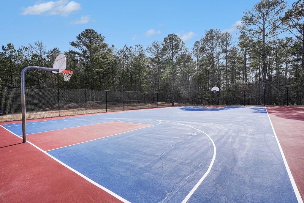 345 Arthurs Lane Covington, GA 30016 - Photo 28 of 33 a swimming pool with trees in the background